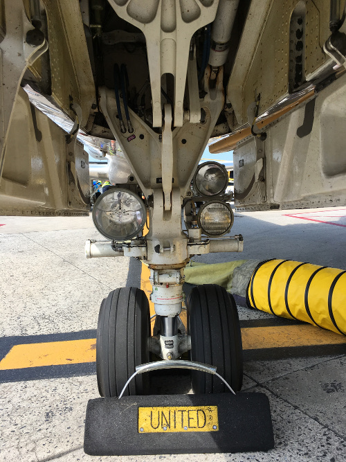 (Image: Nosewheel and lights during a preflight of the E45X)
