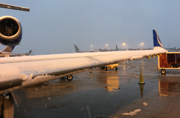 (Image: Wing covered in snow during winter operations in Dulles VA)