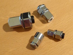 (Image: Closeup of four box end wrench adapters)