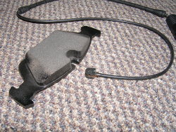 (Image: Brake pad wear sensor shown near pad)