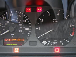 (Image: Instrument cluster with brake lining wear indicator illuminated)
