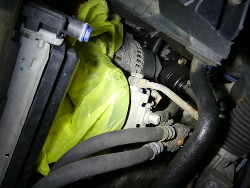 (Image: Closeup of power steering pump with bag over pulley)