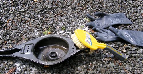 (Image: Using a citrus based degreaser to strip rear control arm of grime)