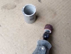 (Image: Using dremel equipped with sanding drum to reduce pvc wall thickness)