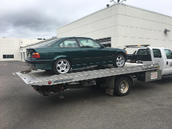 (Image: Vehicle perched up on flatbed ready to leave dealer)