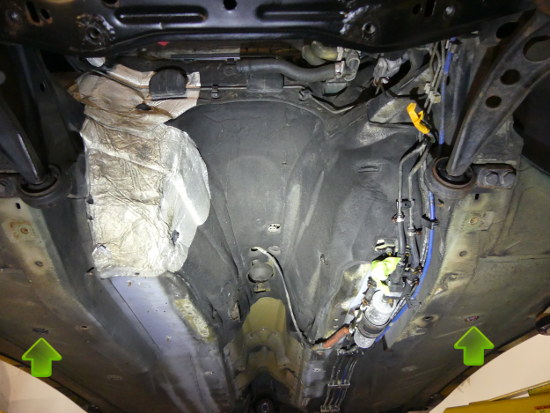 (Image: Underside of vehicle showing open closures and blanket)