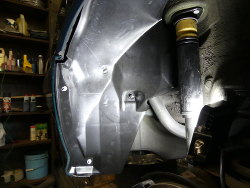 (Image: New wheel well cover installed)