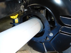 (Image: Using a PVC pipe as a drift to install bearing shield)