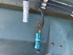 (Image: Closeup of new brake wear sensor electrical connector installed)