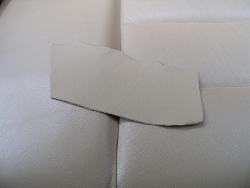 (Image: Closeup of GAHH sand leather swatch on rear seat)