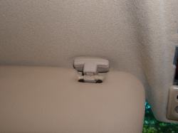(Image: Closeup of headliner with E46 beige visor clip installed)