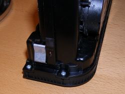 (Image: Side of controller showing faceplate screws)