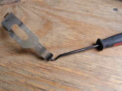(Image: Closeup of hook tool used to remove blower retaining clip)