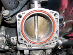 (Image: Closeup of rear of main throttle body after cleaning)