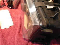 (Image: Side view of headlamp assembly with Lamin-X film installed)