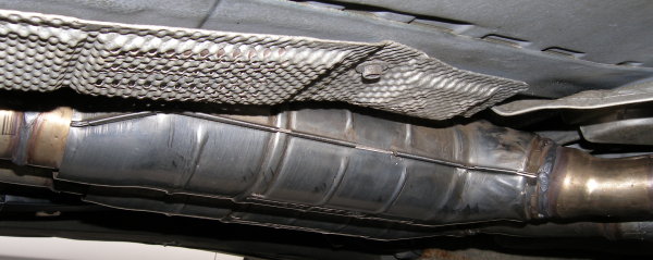 (Image: Closeup of new catalytic converter installed on E36)