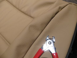 (Image: Technique for loading hogring in pliers so it can pierce fabric)