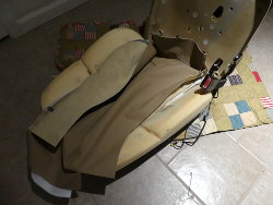 (Image: In process of fastening new leather cover face to backrest foam)