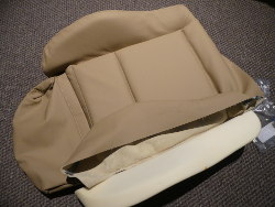 (Image: In process of fastening the leather cover to the seat base)
