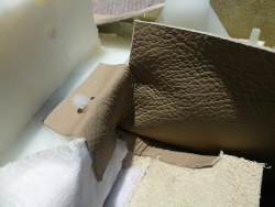 (Image: Closeup of cut made in leather flap fit to inside corner)