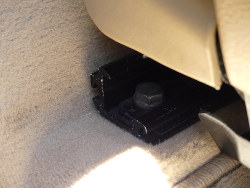 (Image: Closeup of front seat rear mounting bolt)