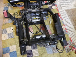 (Image: Seat frame with plastic base removed showing electric motors)