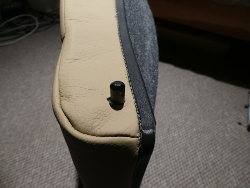 (Image: Rear backrest cover closeup of mountin post with pre-cut hole in leather)