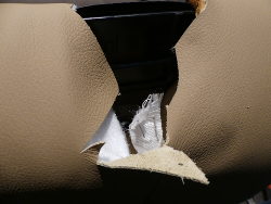 (Image: Closeup of the backrest seatbelt mechanism pocket)