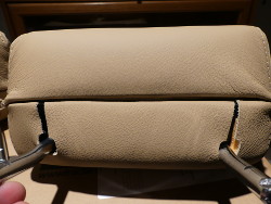 (Image: Closeup of bottom of rear headrest with new cover installed)
