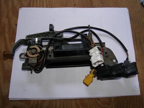 (Image: Rear of the original driver's door handle assembly)