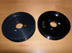 (Image: Side by side comparison of metal and plastic pulley)