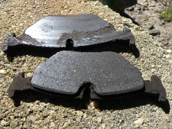 (Image: Comparison of excessive wear on left vs right pads)