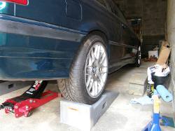 (Image: Rear wheels on ramps for torque of fasteners at ride height)