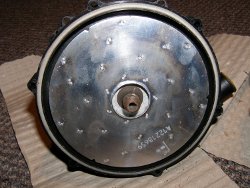 (Image: Old secondary air pump metal radial blower closeup)