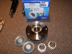 (Image: New SKF OEM front wheel bearing assembly and related parts)