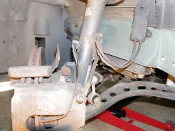 (Image: Closeup of E36 front wheel well showing brake wear sensor wiring)