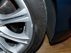 (Image: Closeup of curb rash on front right wheel)
