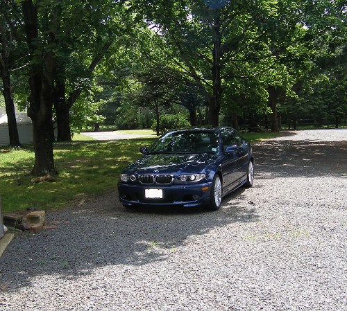 (Image: E46 outside on driveway last summer while E36 gets blower motor installed)