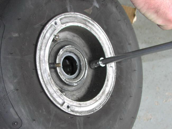 (Image: Removing wheel bolts with rachet)