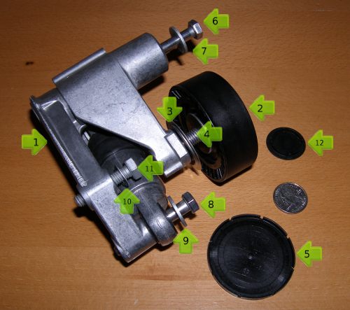 (Image: Closeup of parts associated with the hydraulic accessory belt tensioner)