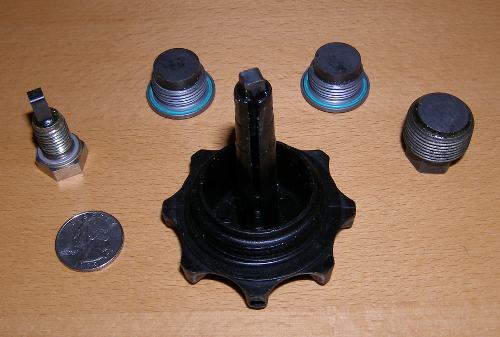 (Image: Closeup of set of magnetic drain plugs)