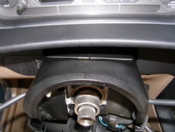 (Image: Closeup of upper steering column cover)