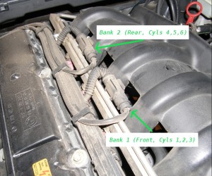 (Image: Location of pre-cat sensor plugs on top of engine)
