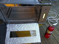 (Image: First test of oven outside with fire extinguisher)
