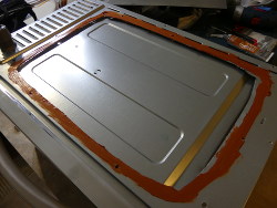 (Image: Rear panel with sealant applied)