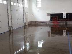 (Image: Garage floor coated with clear sealant)