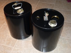 (Image: Waste oil containers from The Cary Company)