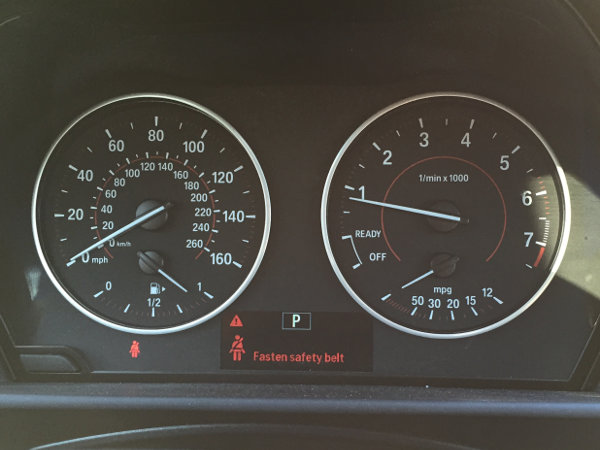 (Image: Closeup of 228 gauge cluster showing fasten seatbelt warning)