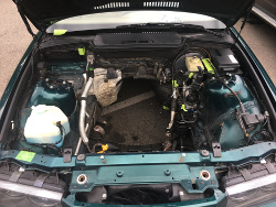 (Image: Showing empty engine bay)