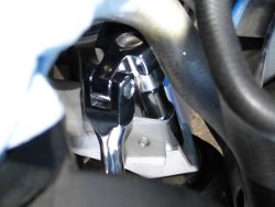 (Image: Using swivel ratchet to tighten top engine mount nut)